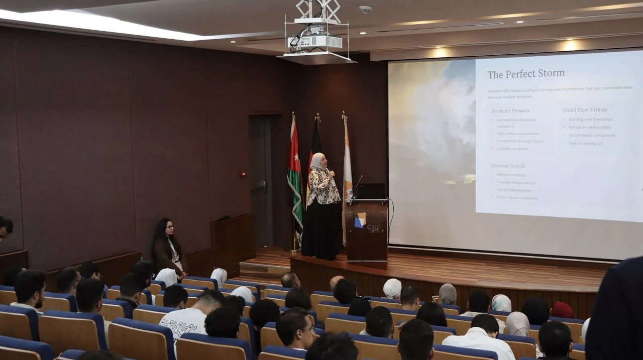A speaker addressing an audience in a lecture hall